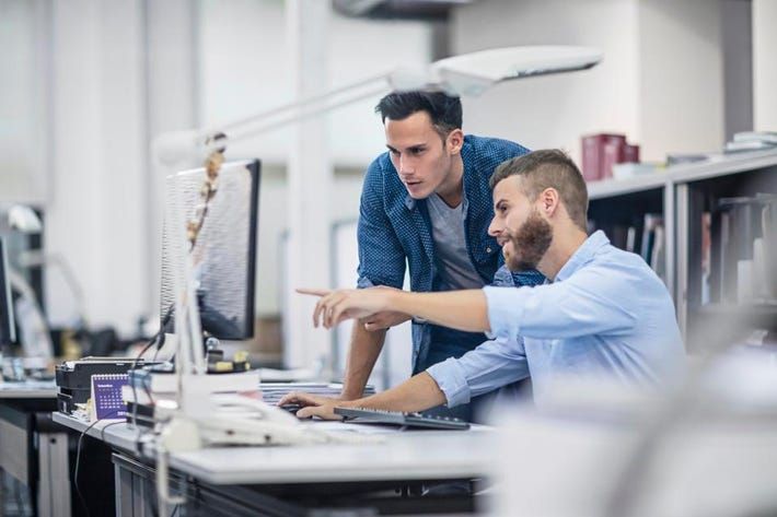 Men using computer in the office